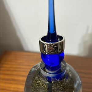 Wide band puppy face ring